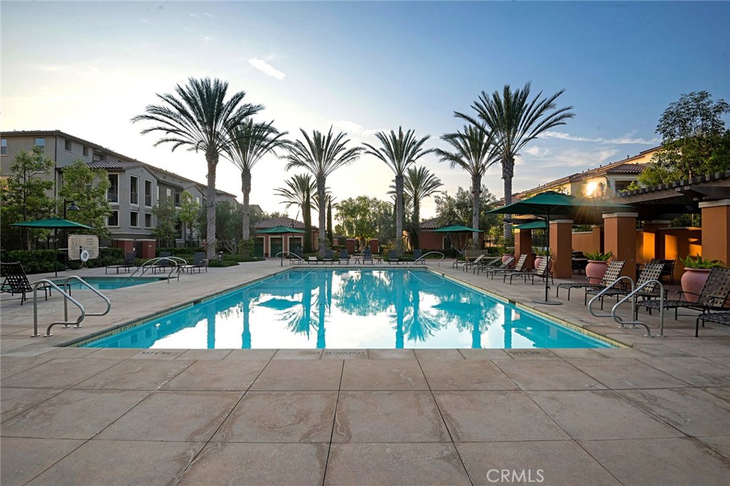 94 Capricorn Irvine, CA 92618 - Photo 42 of 47 a view of outdoor space with swimming pool and furniture