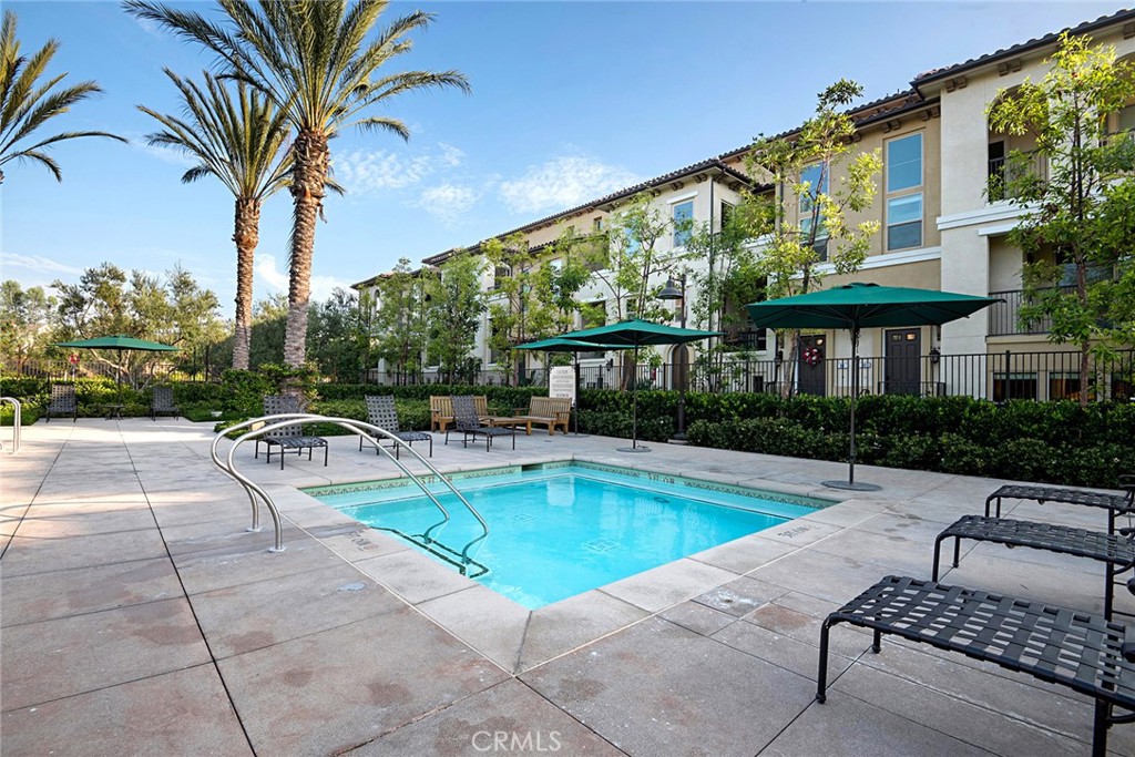 94 Capricorn Irvine, CA 92618 - Photo 47 of 47 a view of a swimming pool with a patio