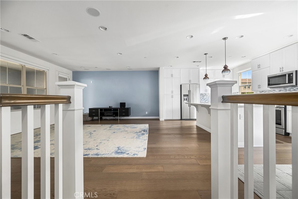 94 Capricorn Irvine, CA 92618 - Photo 8 of 47 a view of a kitchen with wooden floor