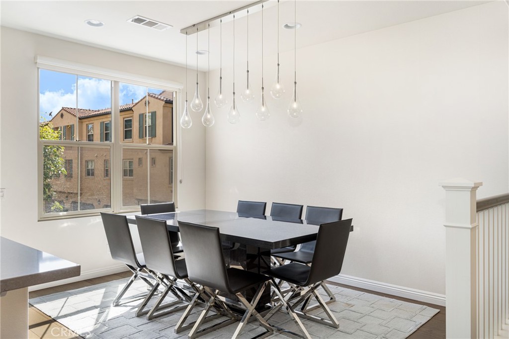 94 Capricorn Irvine, CA 92618 - Photo 9 of 47 a view of a dining room with furniture and wooden floor