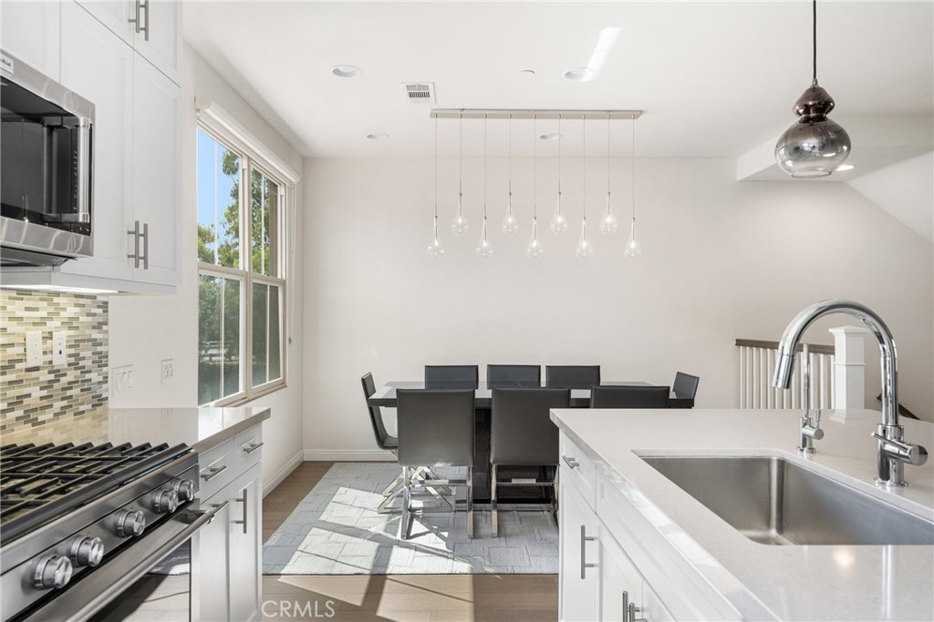 94 Capricorn Irvine, CA 92618 - Photo 10 of 47 a kitchen with a sink cabinets and window