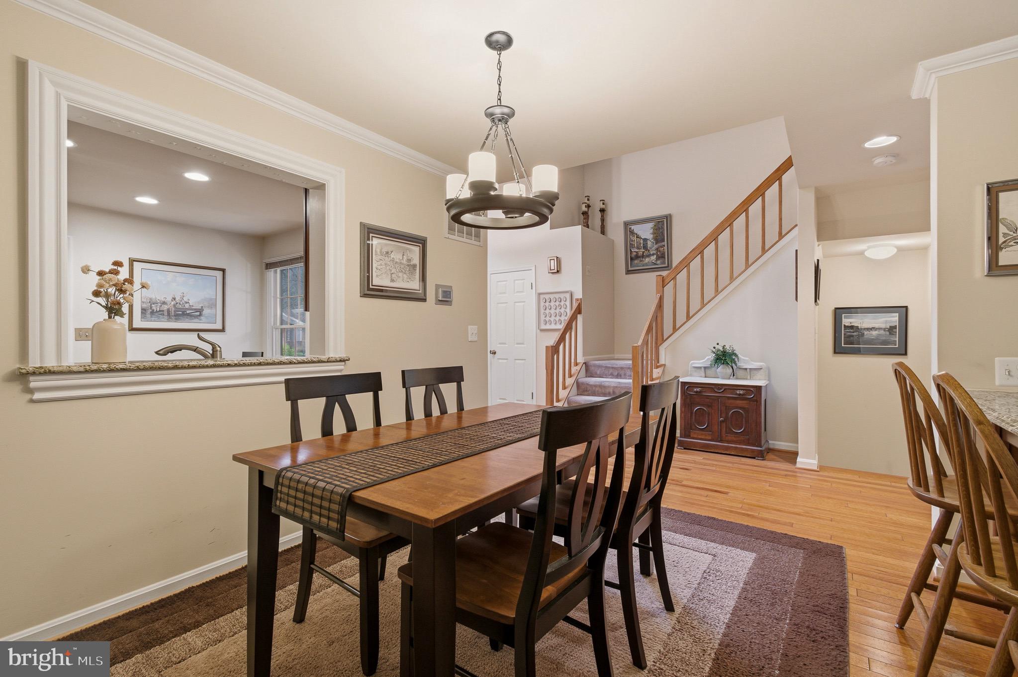 134 Spring Pl Way Annapolis, MD 21401 - Photo 11 of 59 a view of a dining room with furniture and wooden floor