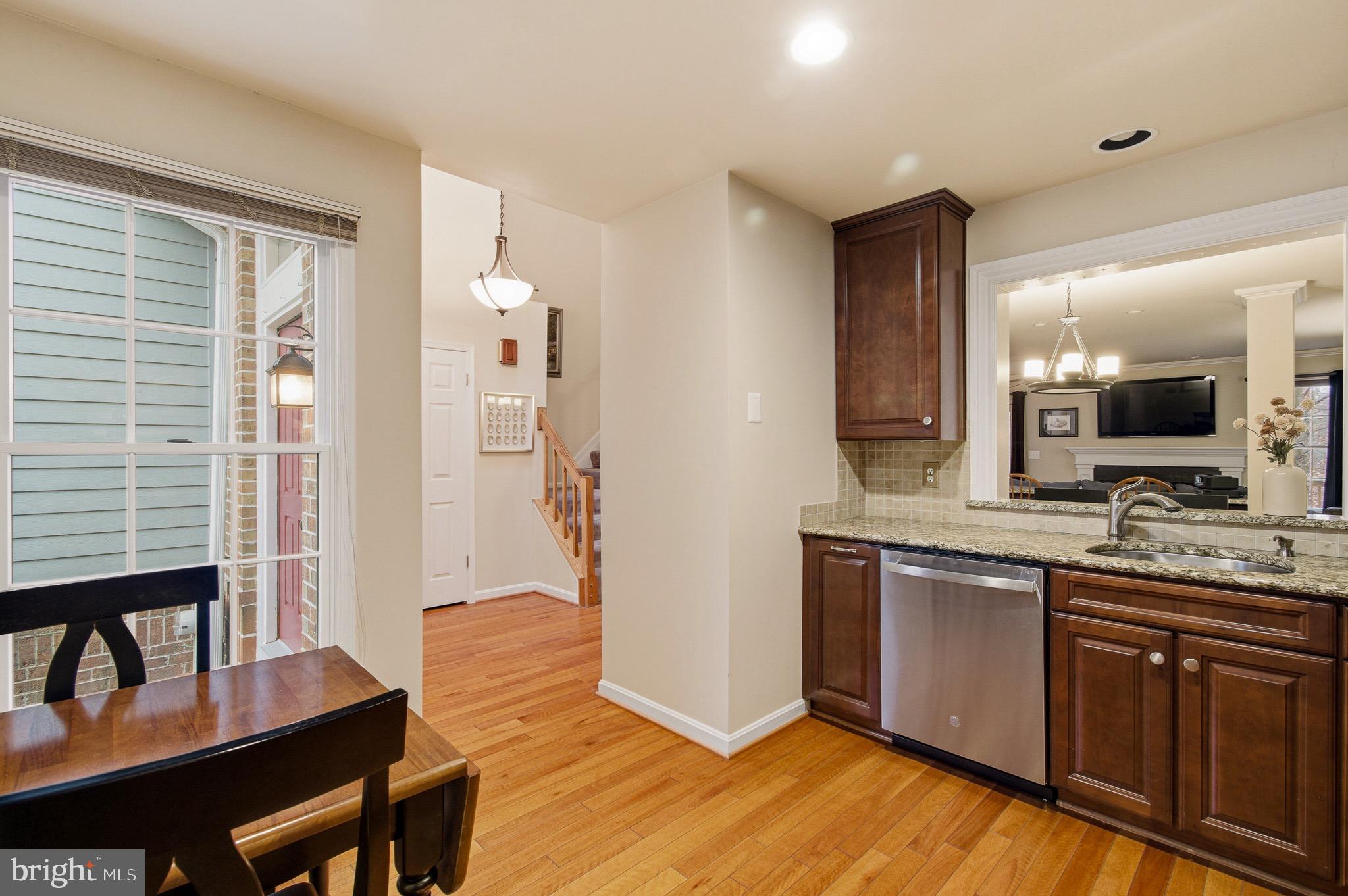 134 Spring Pl Way Annapolis, MD 21401 - Photo 22 of 59 a kitchen with stainless steel appliances granite countertop a sink and wooden floor