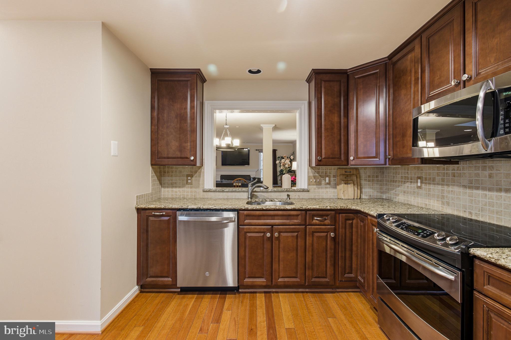 134 Spring Pl Way Annapolis, MD 21401 - Photo 23 of 59 a kitchen with a sink and cabinets