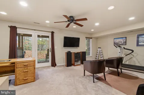 a bedroom with a bed a lamp and a chandelier