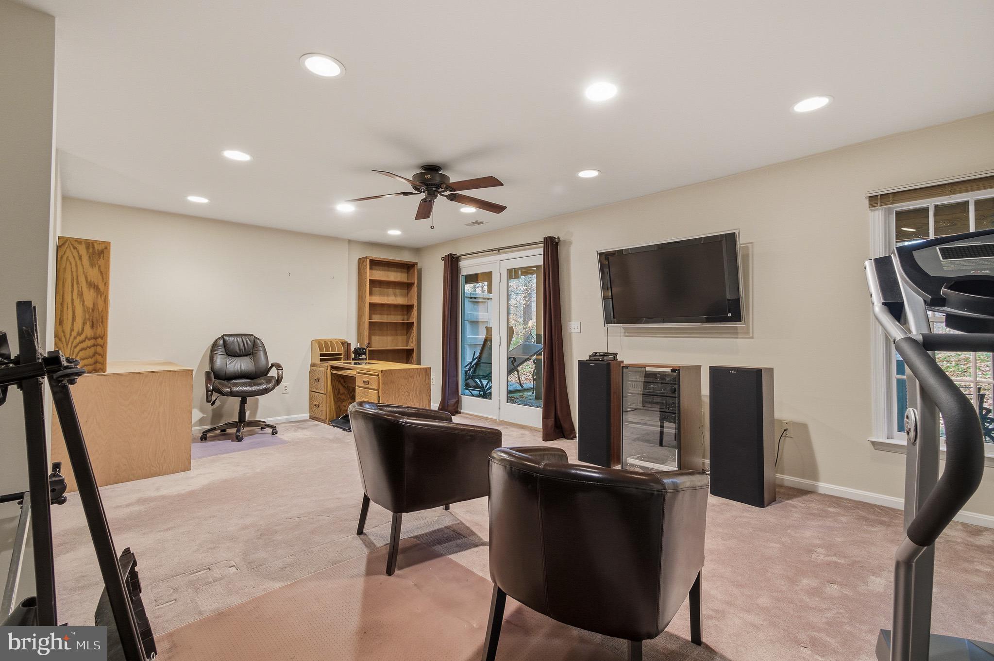 134 Spring Pl Way Annapolis, MD 21401 - Photo 27 of 59 a living room with furniture and a flat screen tv