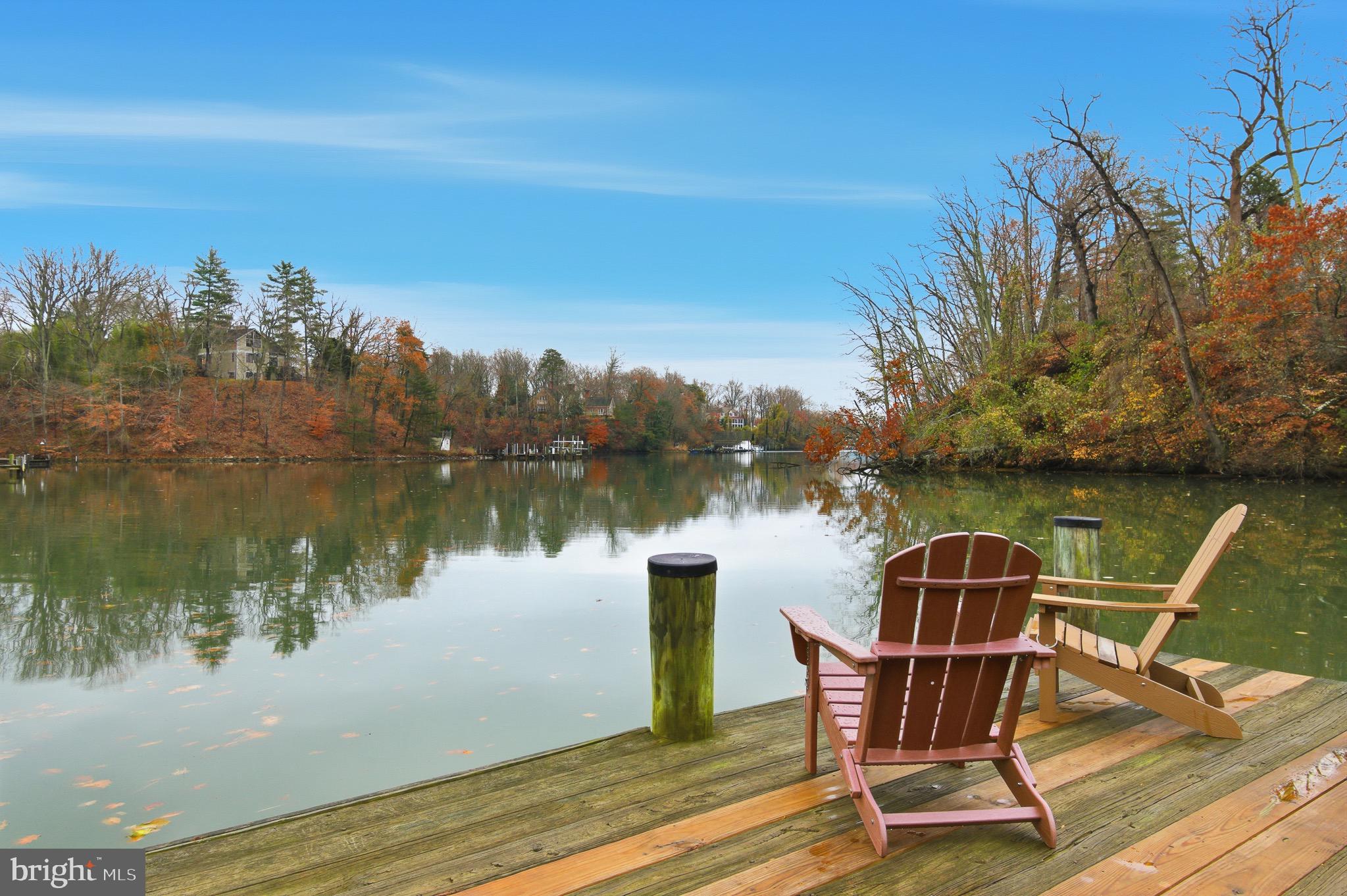 134 Spring Pl Way Annapolis, MD 21401 - Photo 50 of 59 a view of a lake with a deck