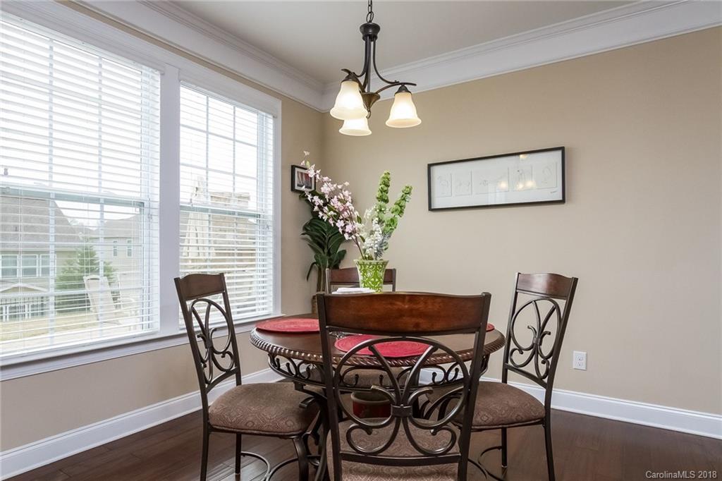1841 Larkspur Way Tega Cay, SC 29708 - Photo 12 of 27 a dining room with furniture and window
