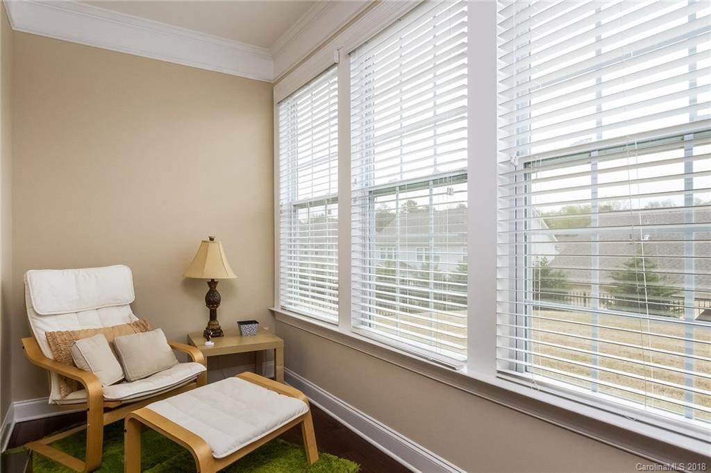 1841 Larkspur Way Tega Cay, SC 29708 - Photo 13 of 27 a living room with furniture and a window