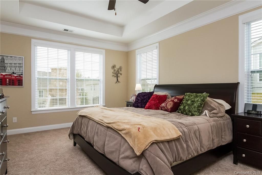 1841 Larkspur Way Tega Cay, SC 29708 - Photo 18 of 27 a bedroom with a bed and a window