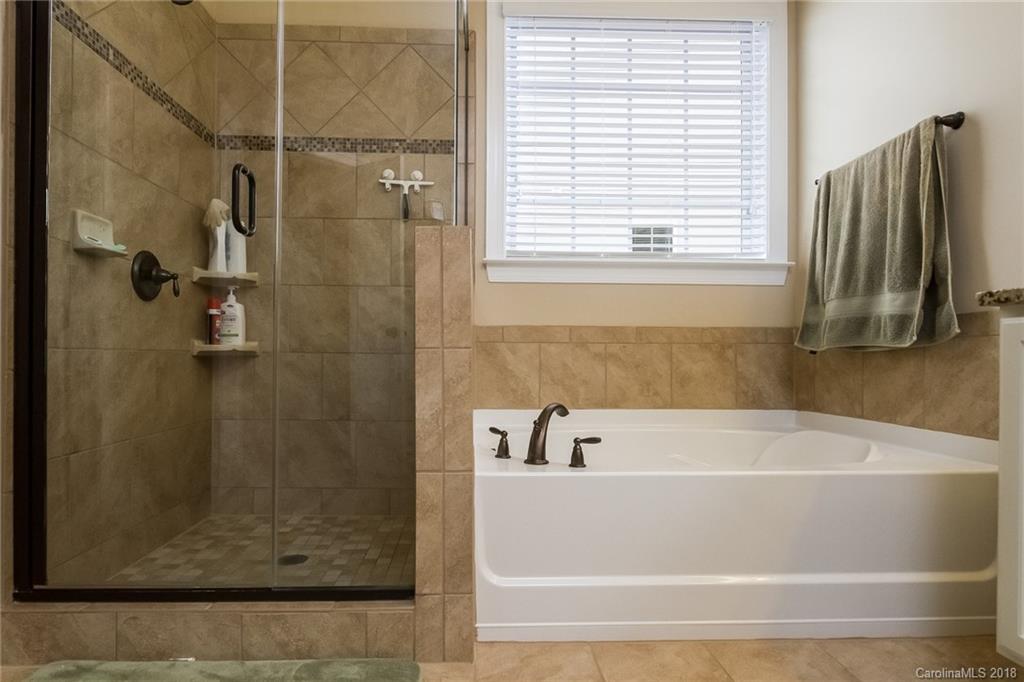 1841 Larkspur Way Tega Cay, SC 29708 - Photo 19 of 27 a bathroom with a bathtub