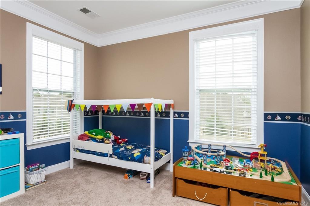 1841 Larkspur Way Tega Cay, SC 29708 - Photo 21 of 27 a room with toys and a table
