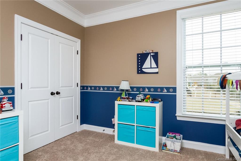 1841 Larkspur Way Tega Cay, SC 29708 - Photo 22 of 27 a view of room with window and cabinet