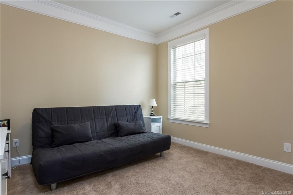 1841 Larkspur Way Tega Cay, SC 29708 - Photo 23 of 27 a living room with furniture and a window