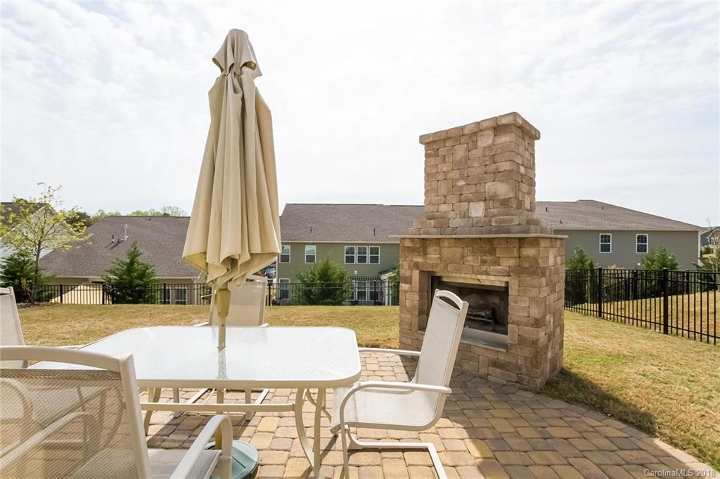 1841 Larkspur Way Tega Cay, SC 29708 - Photo 24 of 27 a table and chairs in the patio