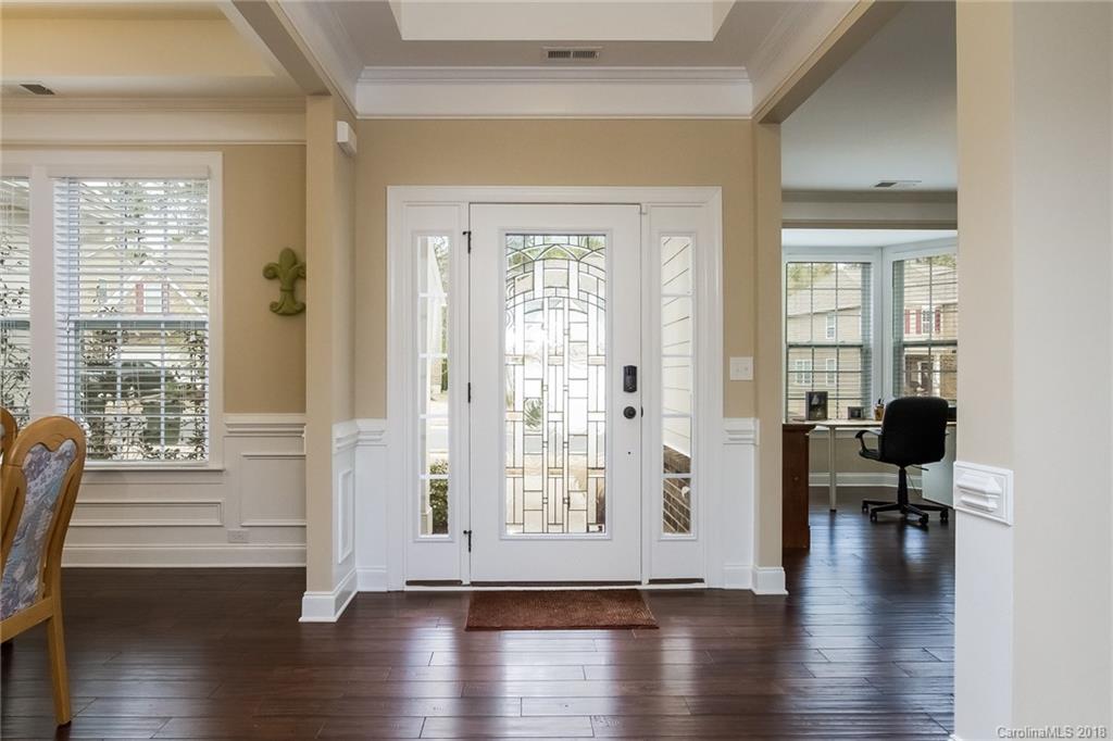 1841 Larkspur Way Tega Cay, SC 29708 - Photo 4 of 27 a view of a livingroom with wooden floor and furniture