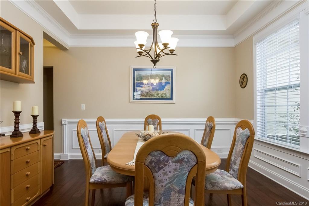 1841 Larkspur Way Tega Cay, SC 29708 - Photo 6 of 27 a view of a dining room with furniture window and wooden floor