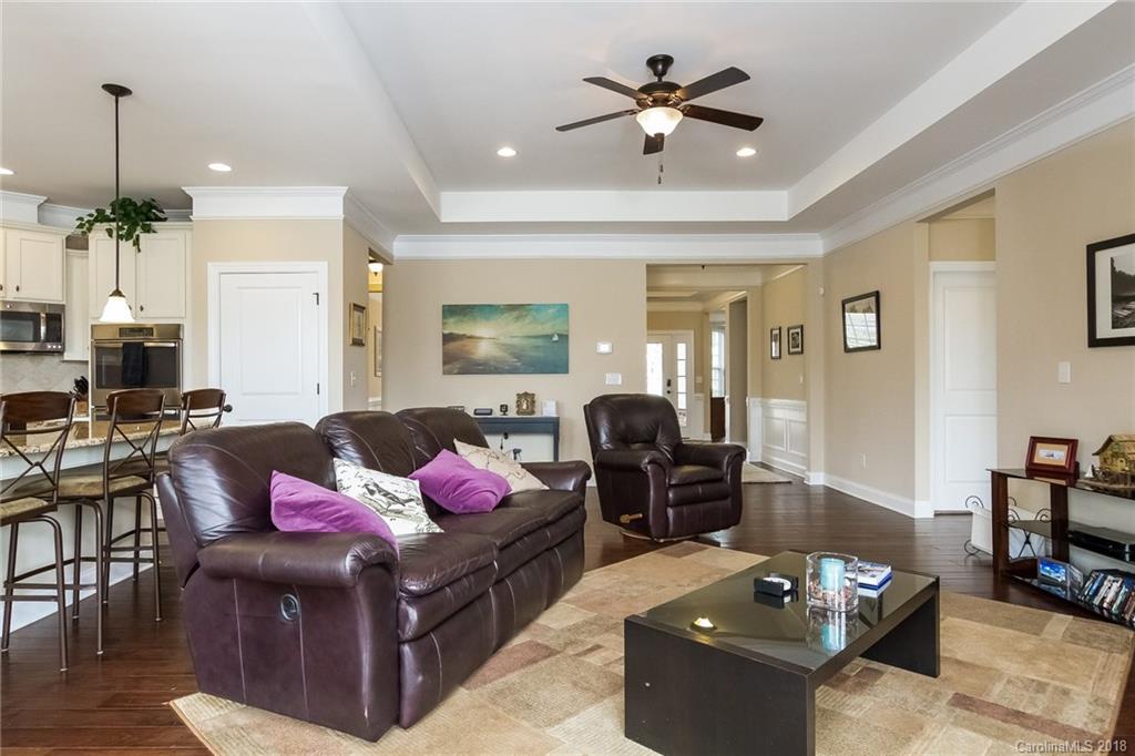 1841 Larkspur Way Tega Cay, SC 29708 - Photo 9 of 27 a living room with furniture and wooden floor