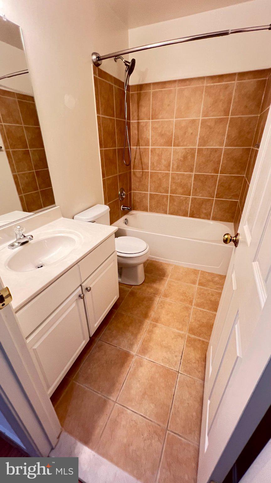 4100 Flower Fairfax, VA 22030 - Photo 31 of 47 a bathroom with a granite countertop sink toilet and shower