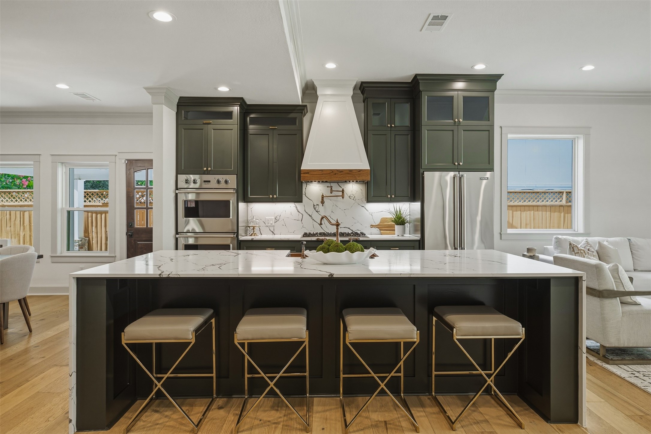 1535 Rutland Street Houston, TX 77008 - Photo 15 of 50 a kitchen with a table chairs refrigerator and microwave