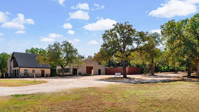 a swimming pool with outdoor seating and yard