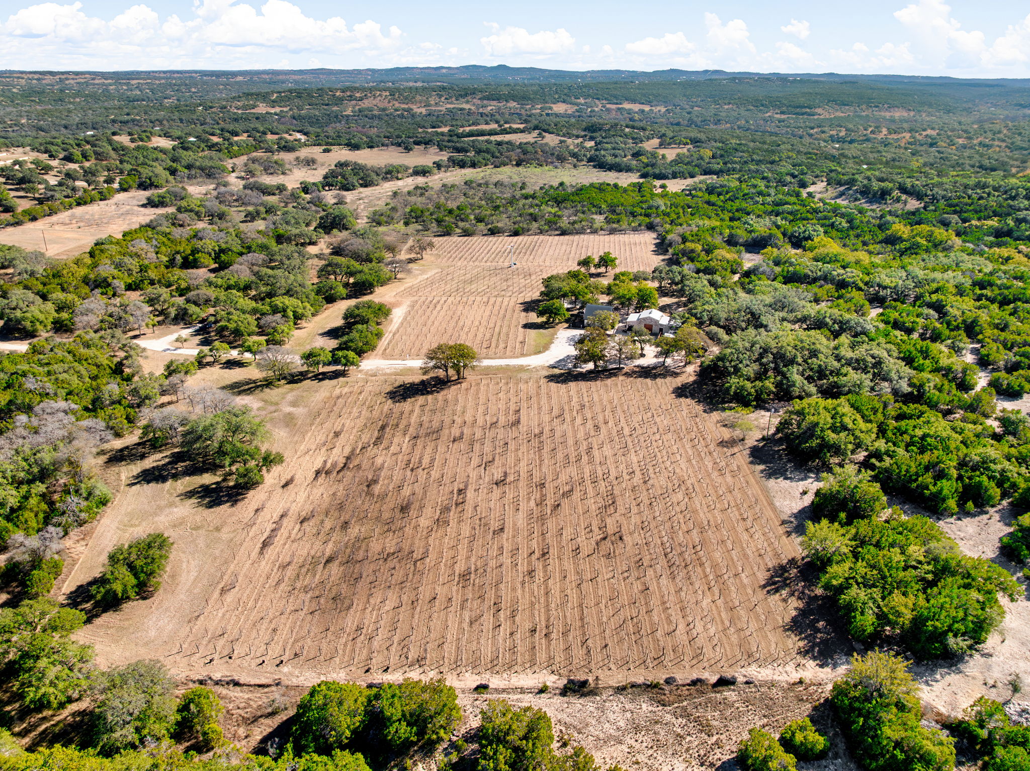 25711 Hamilton Pool Road Round Mountain, TX 78663 - Photo 26 of 39 an aerial view of lot of residential houses with outdoor space