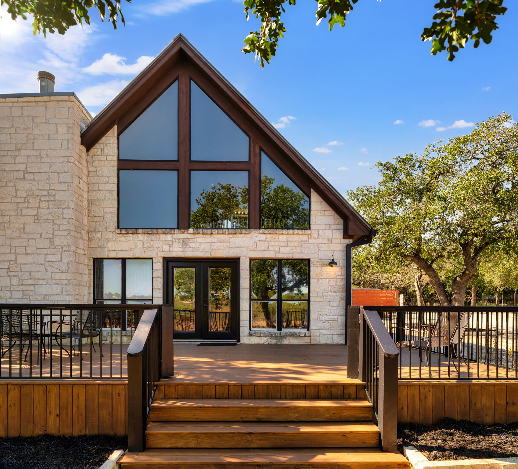25711 Hamilton Pool Road Round Mountain, TX 78663 - Photo 31 of 39 a view of a house with a iron gate