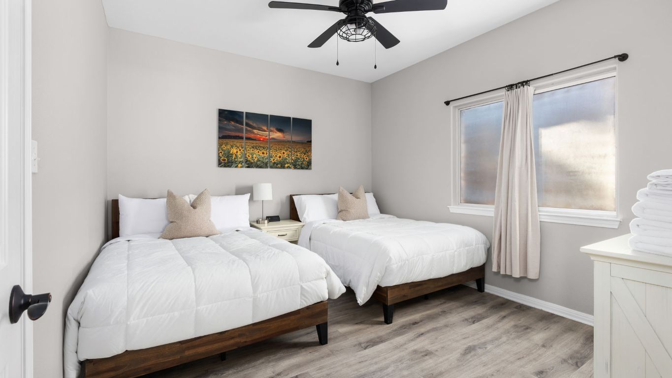 25711 Hamilton Pool Road Round Mountain, TX 78663 - Photo 34 of 40 a bedroom with bed and a window