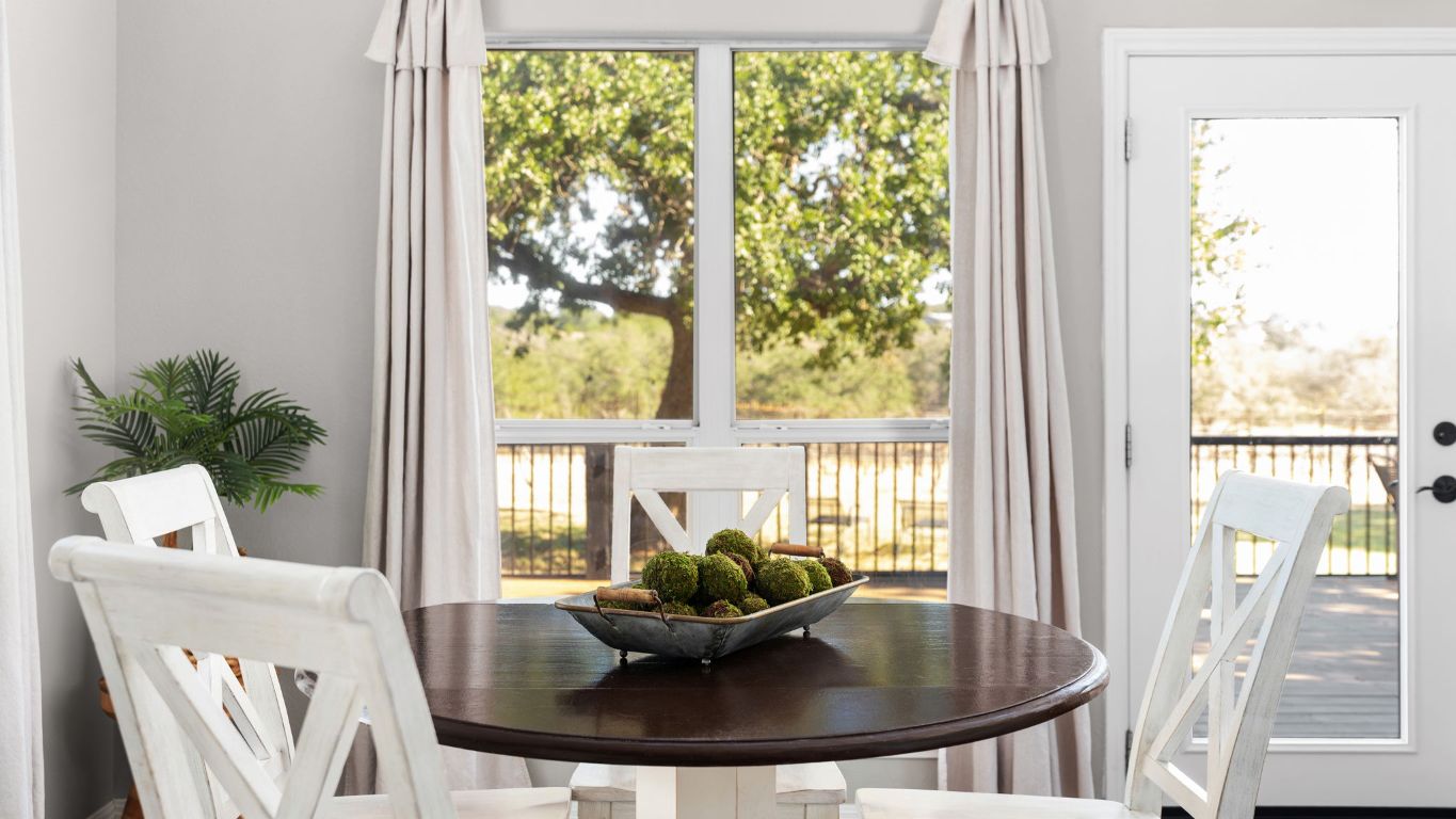 25711 Hamilton Pool Road Round Mountain, TX 78663 - Photo 37 of 40 a living room with furniture and a potted plant