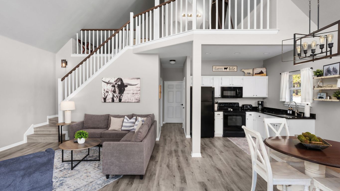 25711 Hamilton Pool Road Round Mountain, TX 78663 - Photo 38 of 40 a living room with furniture and kitchen view