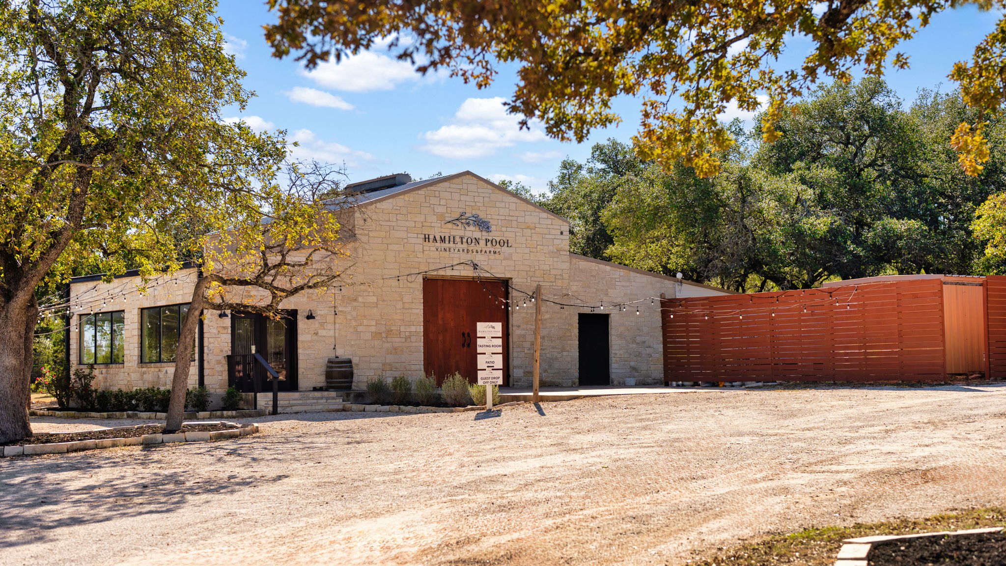 25711 Hamilton Pool Road Round Mountain, TX 78663 - Photo 6 of 39 a front view of a house with a yard