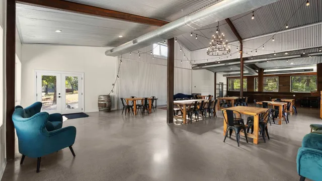 a living room with lots of furniture and a chandelier