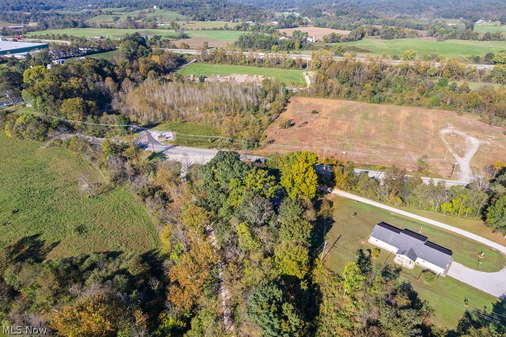 58 Rock Ridge Road Mineral Wells, WV 26150 - Photo 37 of 38 Expansive property with a single-story residence featuring a gray shingle roof and a paved driveway