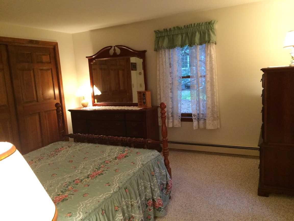 30 Lumbert Mill Road Centerville, MA 02632 - Photo 15 of 19 a bedroom with a bed and a mirror