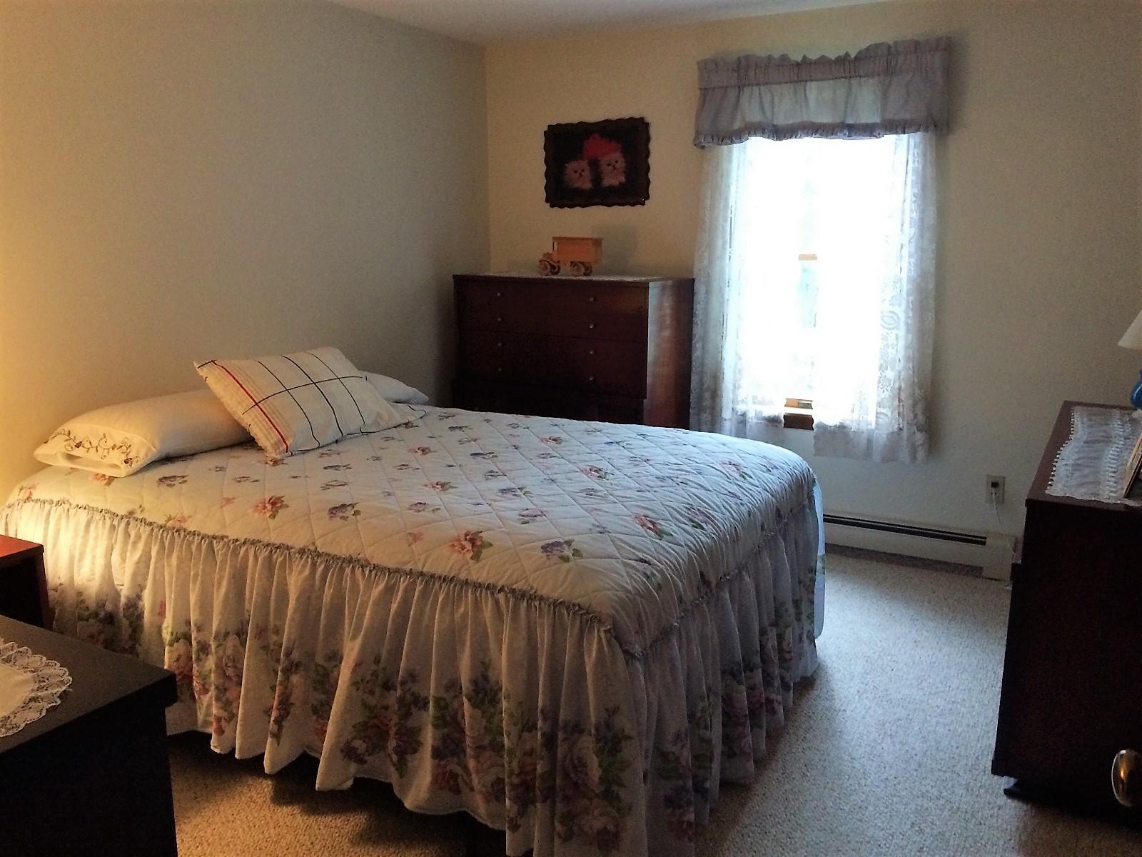30 Lumbert Mill Road Centerville, MA 02632 - Photo 16 of 19 a bed sitting in a bedroom next to a window