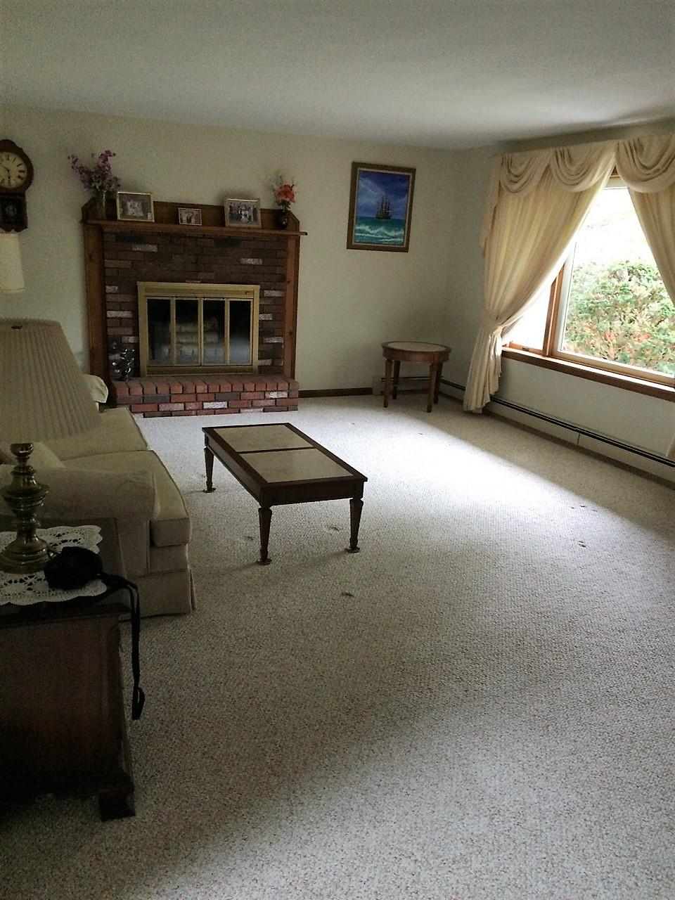 30 Lumbert Mill Road Centerville, MA 02632 - Photo 5 of 19 a living room with furniture a flat screen tv and a fireplace