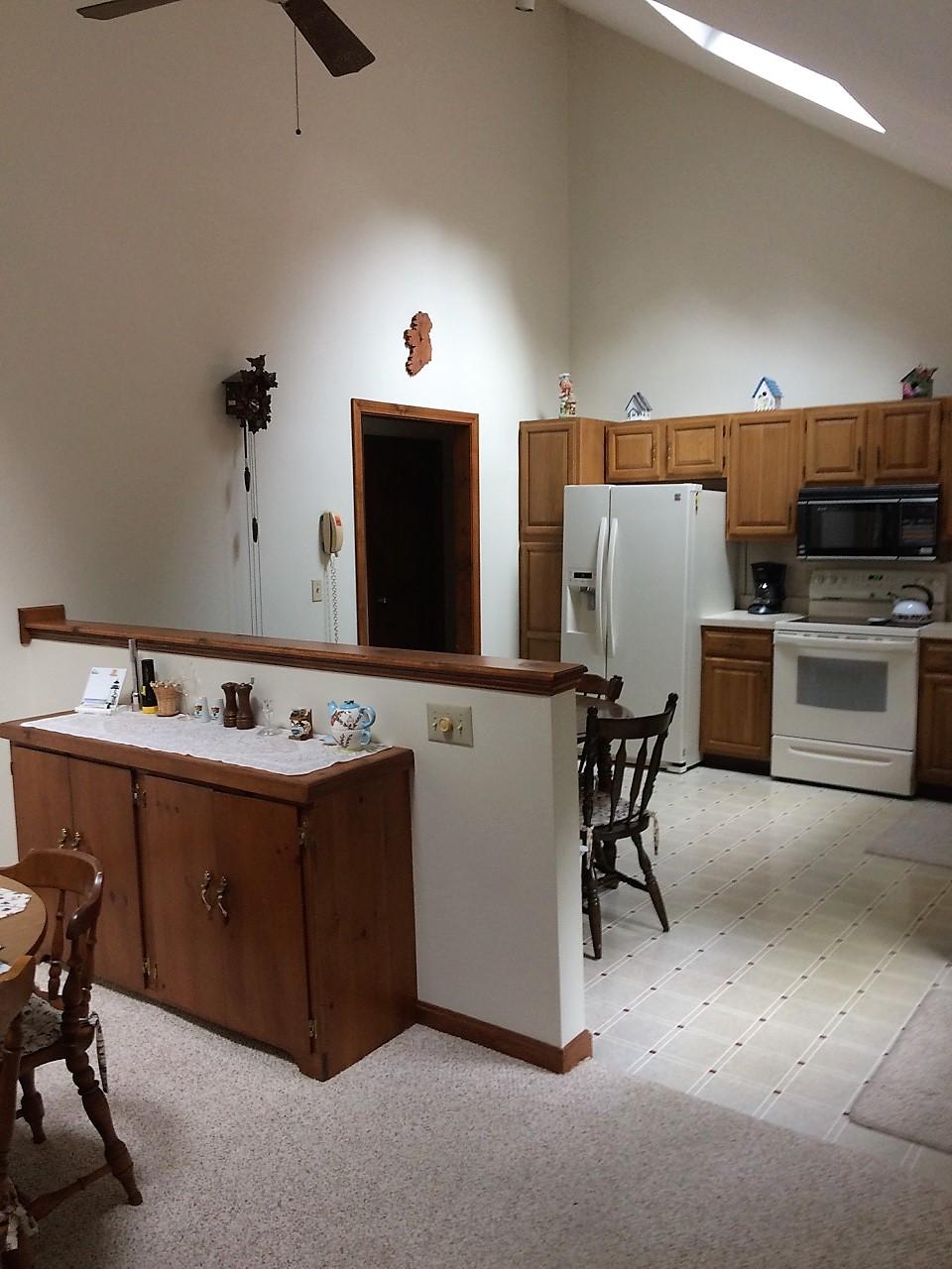 30 Lumbert Mill Road Centerville, MA 02632 - Photo 7 of 19 a room with a sink a stove and chairs