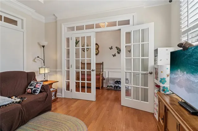 a view of a livingroom with workspace and a window