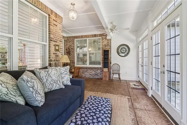 a bathroom with a granite countertop sink a mirror a vanity and a shower