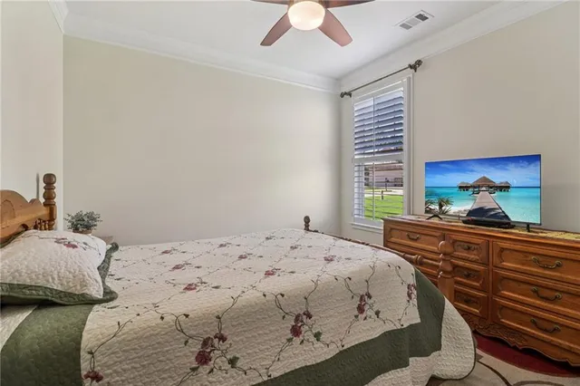 a view of a house with a big yard and large trees