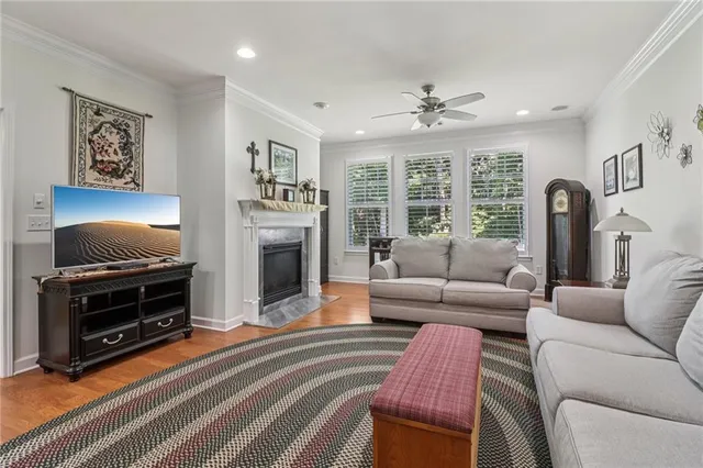 a view of a dining room with furniture wooden floor and chandelier
