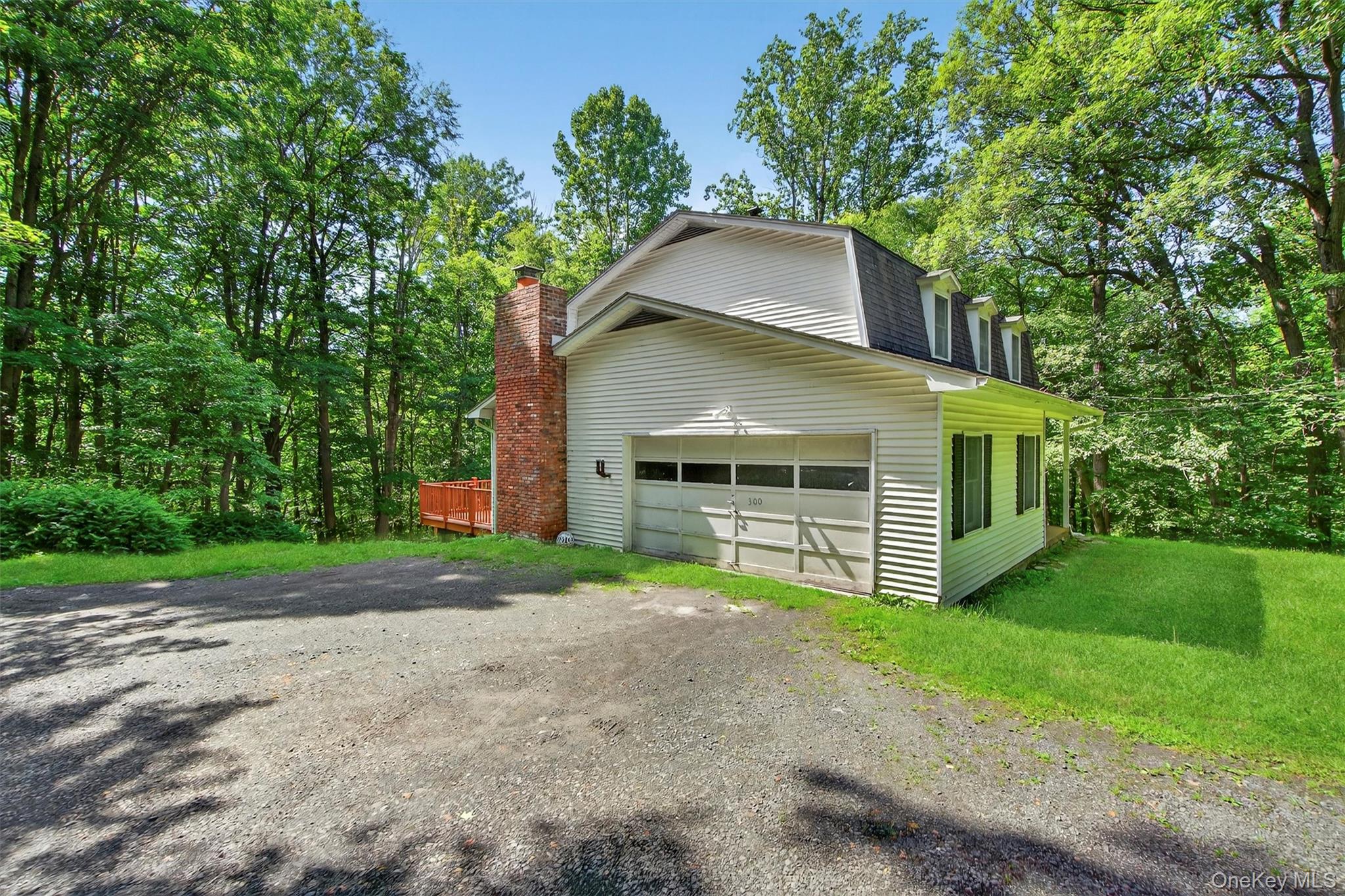 300 Estrada Road Central Valley, NY 10917 - Photo 16 of 30 a front view of a house with garden