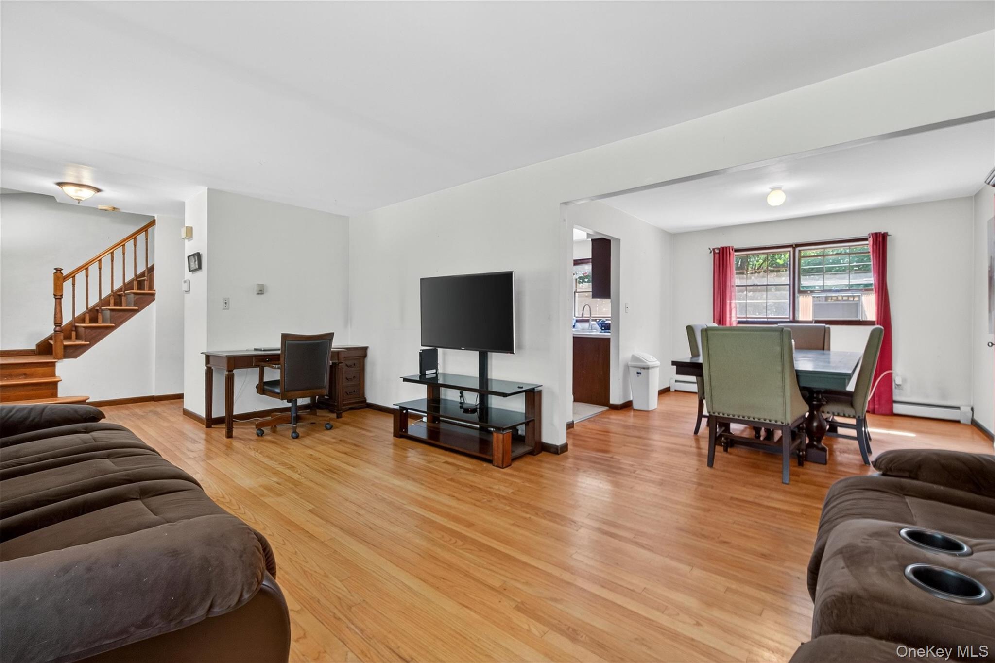300 Estrada Road Central Valley, NY 10917 - Photo 24 of 30 a living room with furniture and a flat screen tv with wooden floor