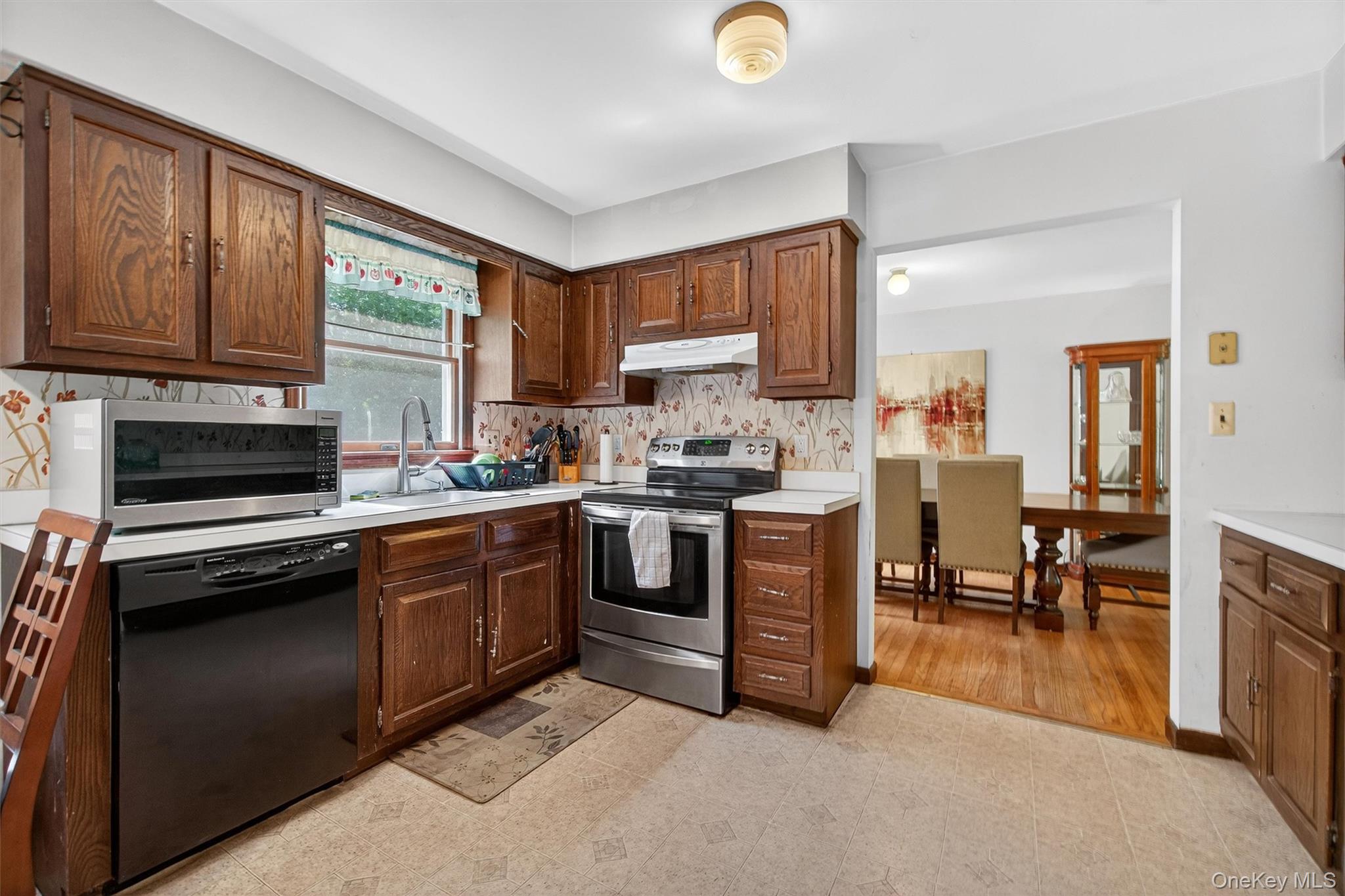 300 Estrada Road Central Valley, NY 10917 - Photo 29 of 30 a kitchen with a sink stove and cabinets