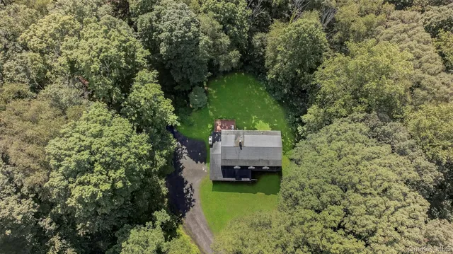a aerial view of a house with a yard