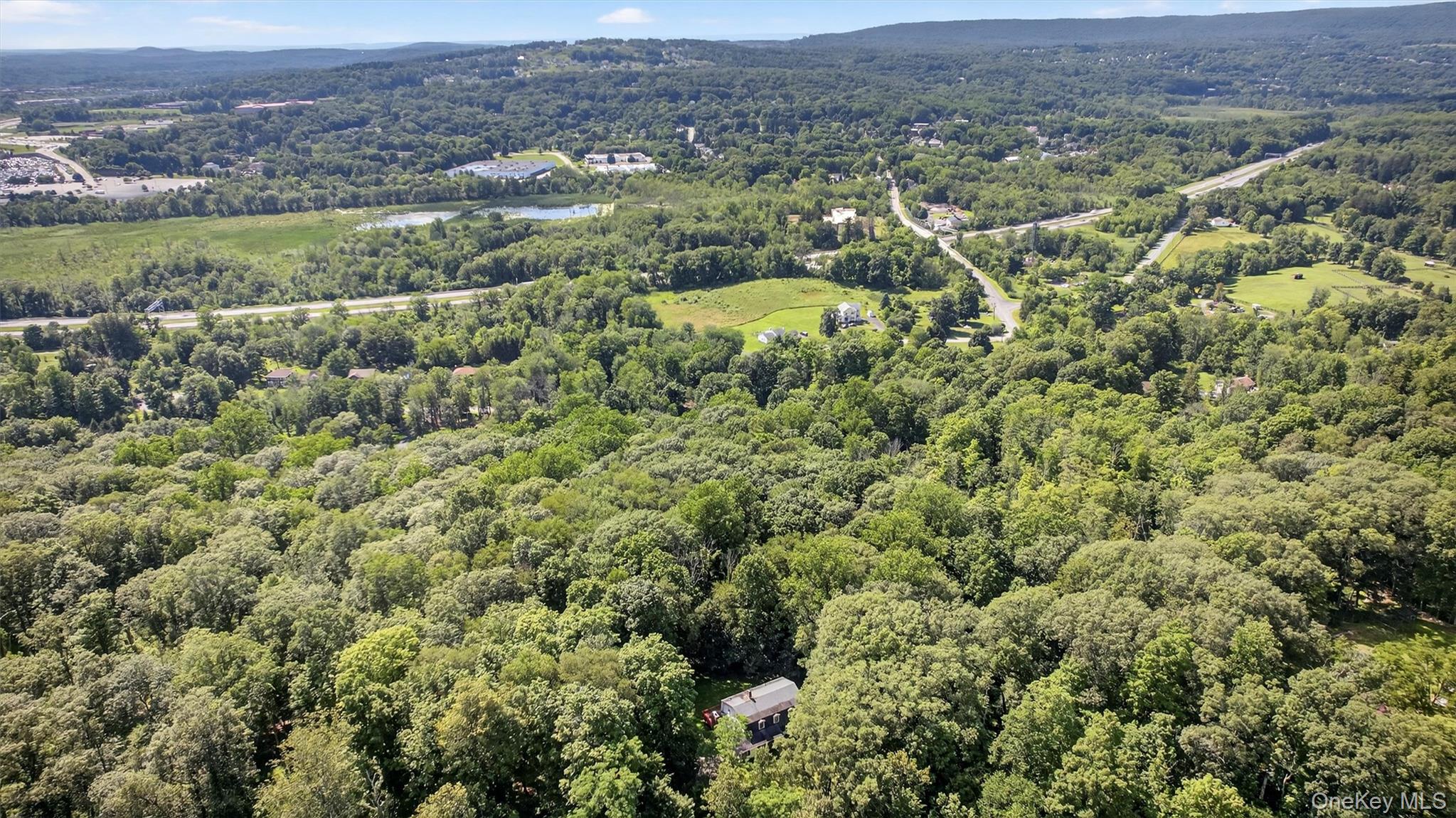 300 Estrada Road Central Valley, NY 10917 - Photo 7 of 30 an aerial view of residential houses with outdoor space and trees