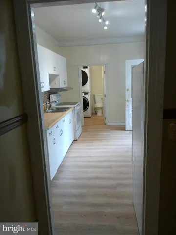 a kitchen with stainless steel appliances a sink and cabinets