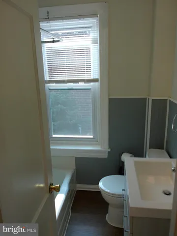 a bathroom with a shower and toilet