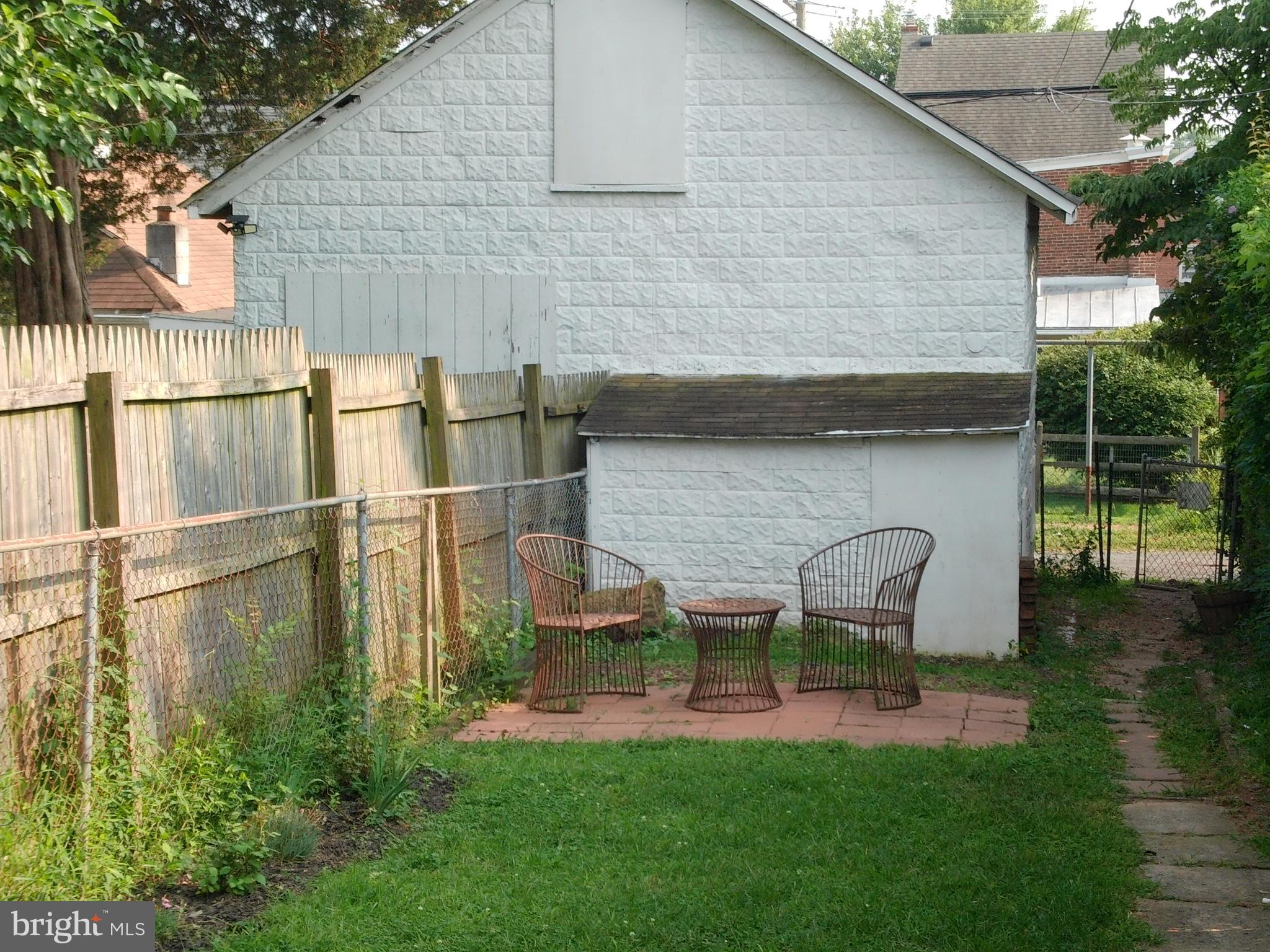1116 Queen Street Pottstown, PA 19464 - Photo 7 of 48 a backyard of a house with table and chairs