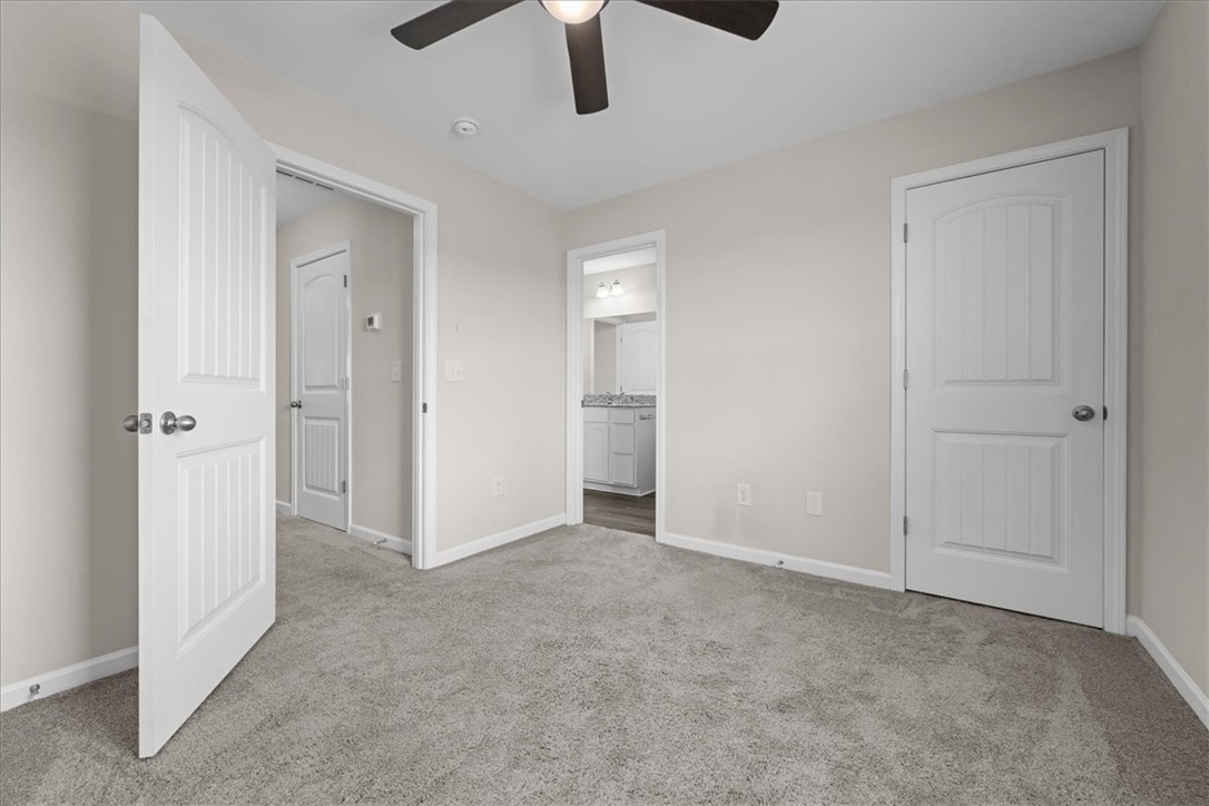 115 Adger Road Pendleton, SC 29670 - Photo 26 of 36 A spacious bedroom provides a comfortable retreat with plush carpeting and convenient access to a private bath.